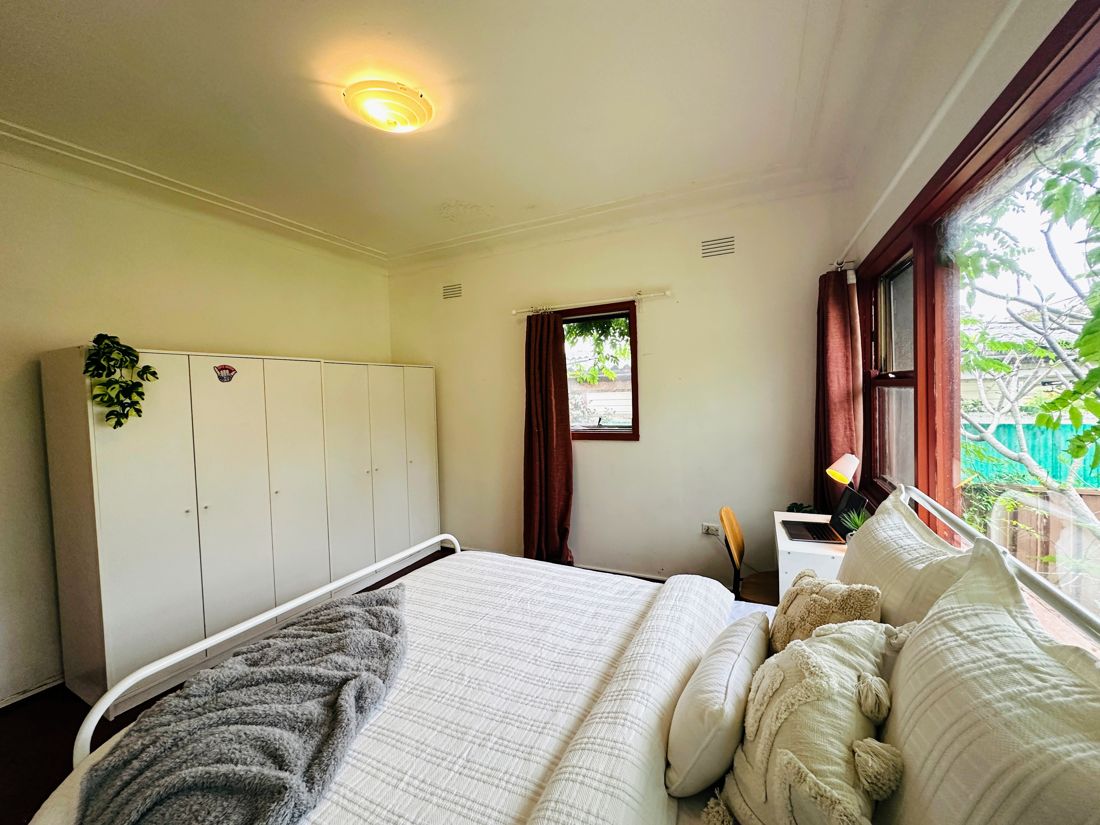 Furnished bedroom with wardrobe, bed, desk and chair